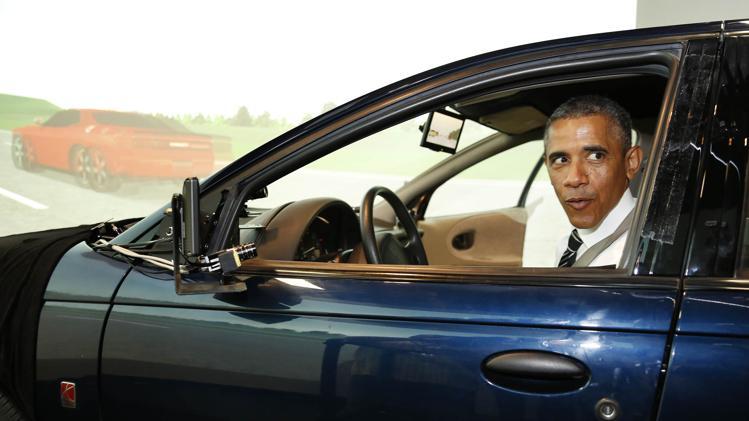 US President Barack Obama behind the wheel of a self-driving car