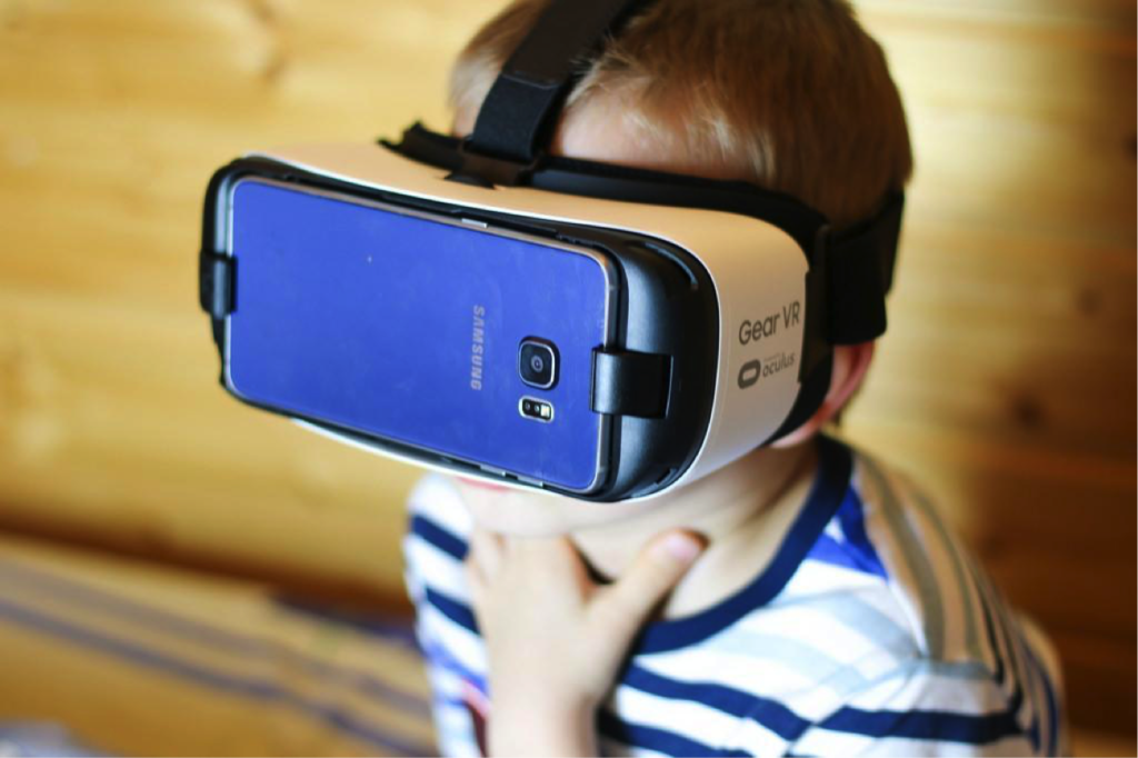 Kid with Samsung GearVR virtual reality head-mounted device (HMD)