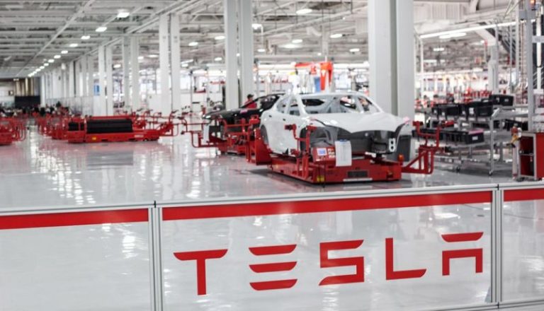 Tesla shares surge past $920 million debt conversion price